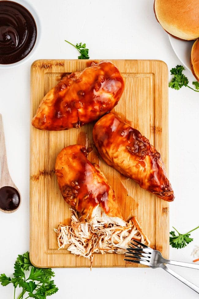 pulled bbq chicken on a cutting board