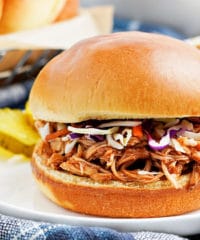 Slow Cooker Pulled Chicken on a bun with coleslaw