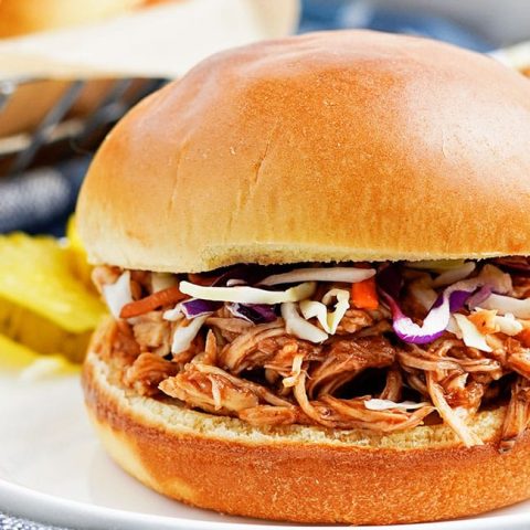 Slow Cooker Pulled Chicken on a bun with coleslaw