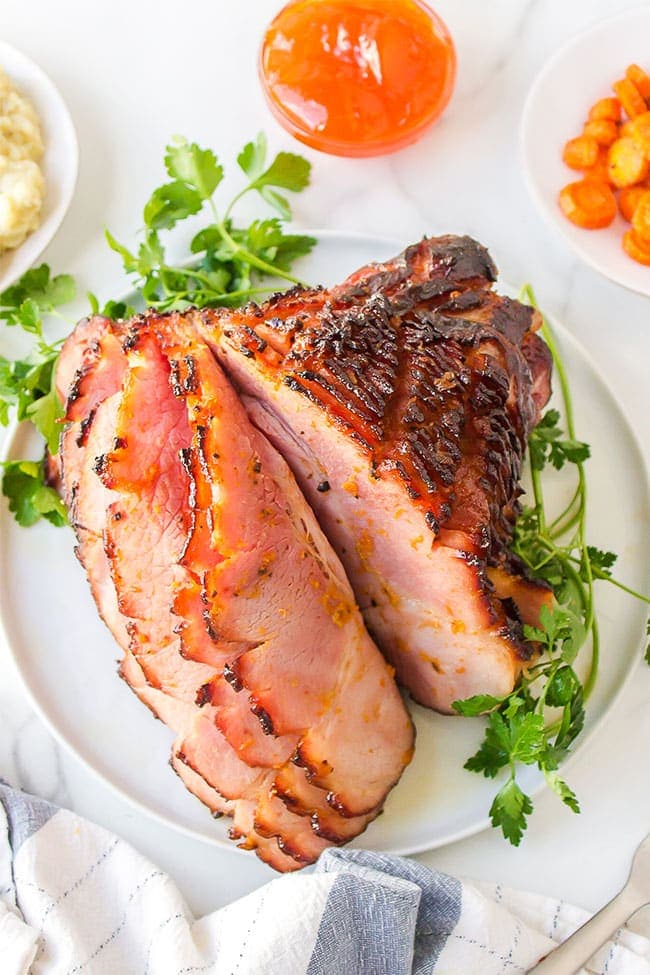 honey glazed spiral ham on a platter