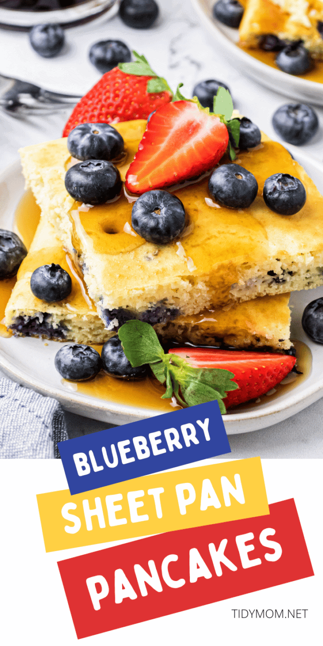 a stack of oven baked pan sheet pancakes on a plate with fresh fruit