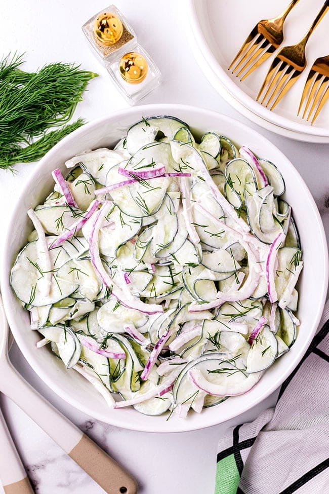 Bowl of creamy cucumber and onion salad