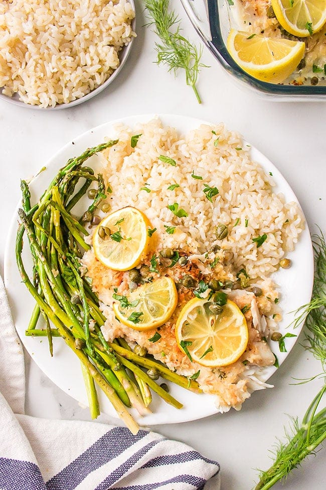 Lemon Parmesan Tilapia on a plate with asparagus and rice