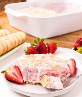 Easy frozen strawberry dessert with cool whip on a white plate