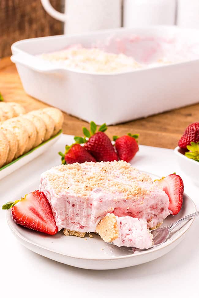 Easy frozen strawberry dessert with cool whip on a white plate