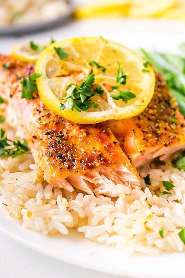 Oven baked citrus salmon plated over rice.