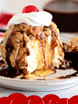 close up of fried ice cream with bite taken drizzled with honey