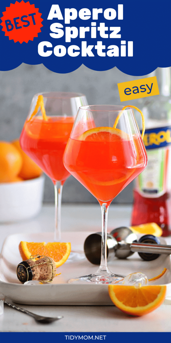 Aperol Spritz cocktail in wine glasses with fresh oranges