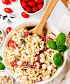 Caprese Macaroni Salad with fresh tomatoes in a serving bowl