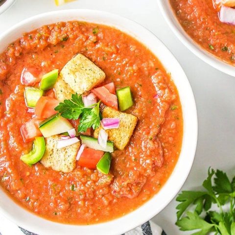 cold Spanish soup in a white bowl