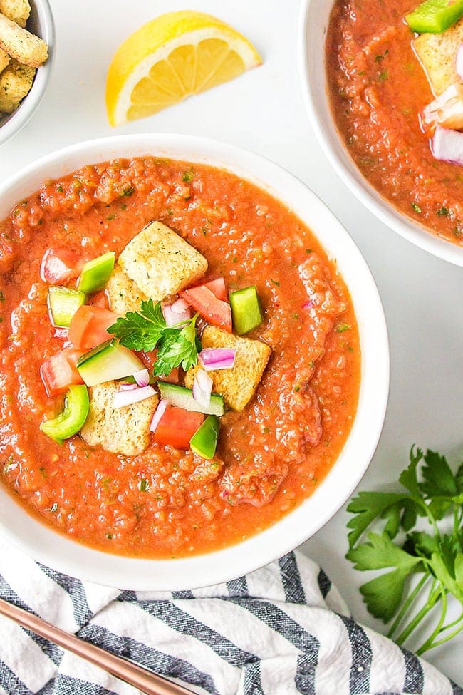 cold Spanish soup in a white bowl