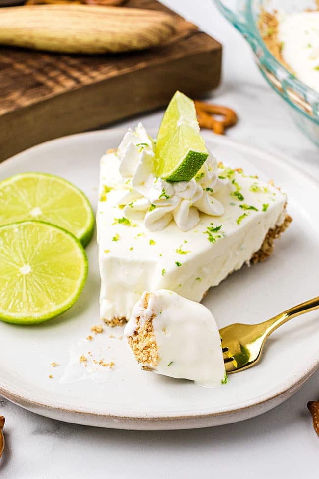 A piece of margarita pie with a bite on a fork