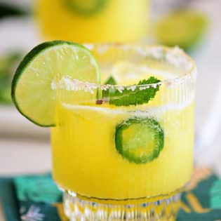 Pineapple Jalapeño Margarita in a glass with lime slice granish