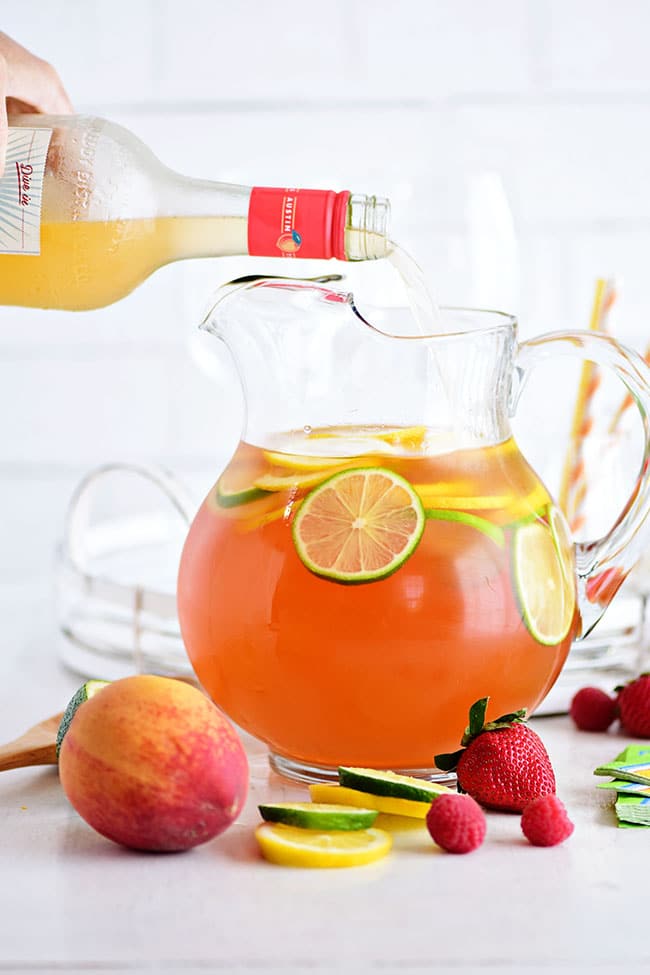 Summer love! A pitcher with peach sangria and fresh fruit and vodka