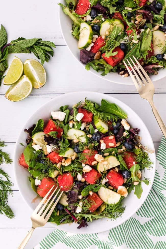 2 white bowls with watermelon salad