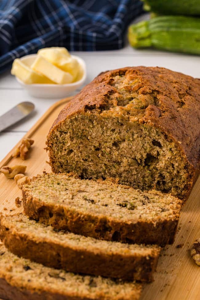sliced loaf of zucchini bread with walnuts