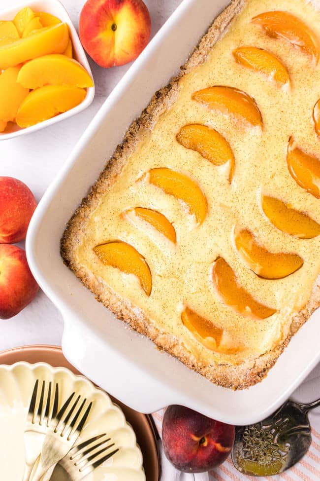 Peach kuchen in a white baking dish