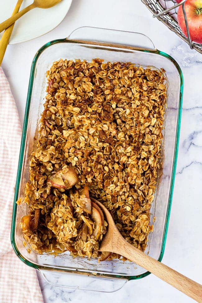 Apple dessert with oat topping in a glass baking dish