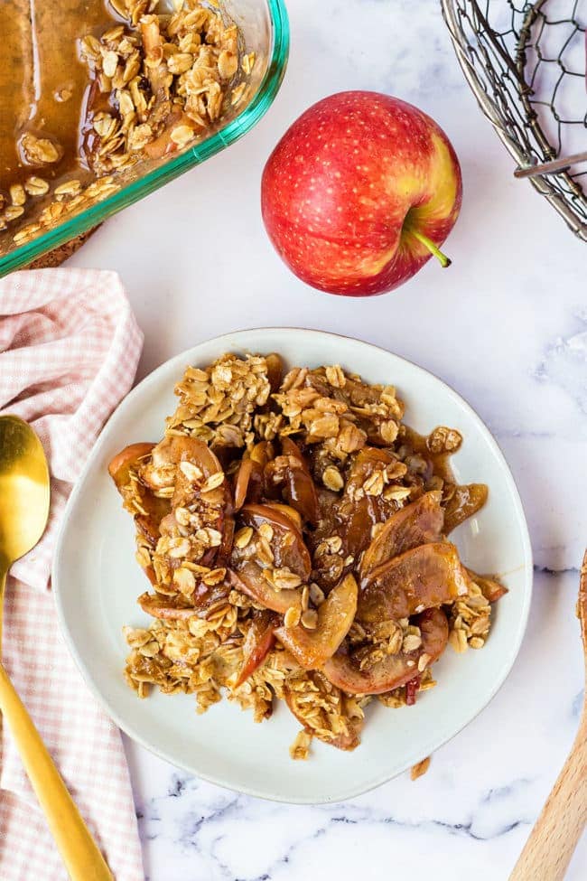 Old fashioned apple oat crisp on a white plate