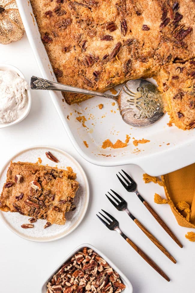 Pumpkin Dump Cake with yellow cake mix served from a white baking dish