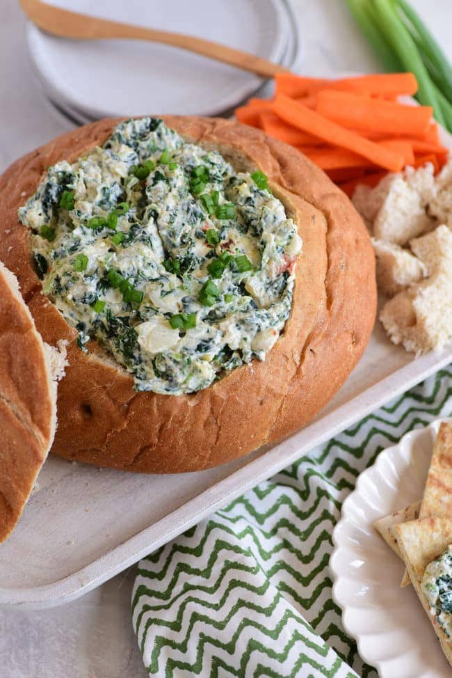 Creamy cold Knorr spinach dip in a bread bowl