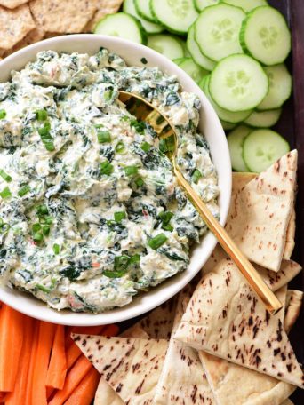 No-bake Creamy Knorr spinach dip on a tray with veggies