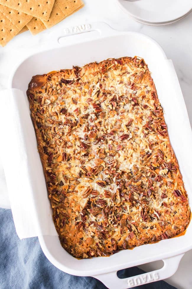 white baking dish with hello dolly magic bars