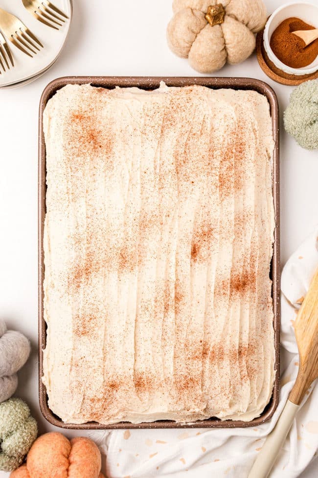 A sheet pan with Pumpkin Bars with browned butter frosting