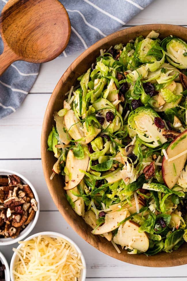 close up of Brussels Sprouts Salad in a wood bowl