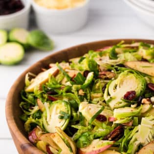 Wood bowl with shredded Brussels Sprouts Salad