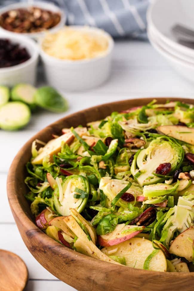 Wood bowl with shredded Brussels Sprouts Salad