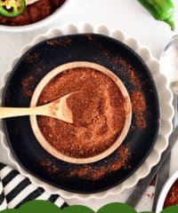 small wooden bowl with homemade chili seasoning mix