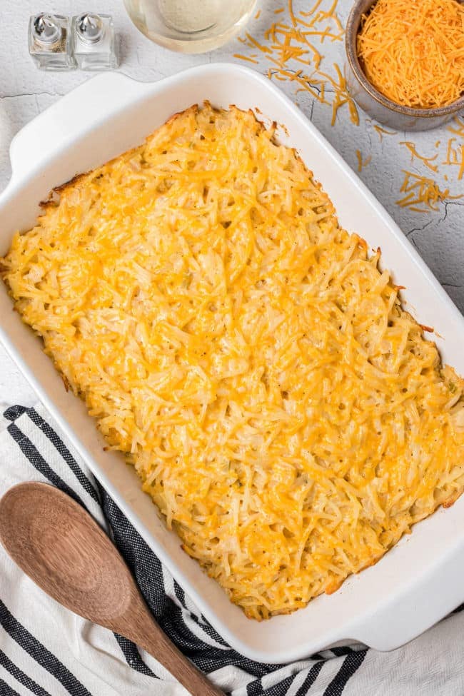 hashbrown potato casserole in a white baking dish