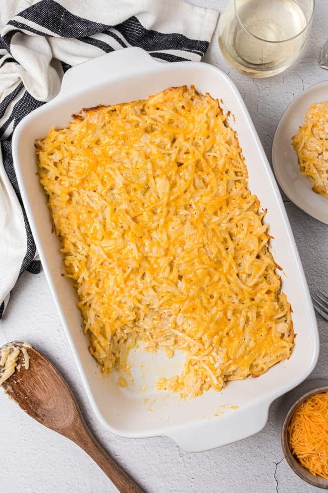 photo of hashbrown casserole in a white baking dish on a counter