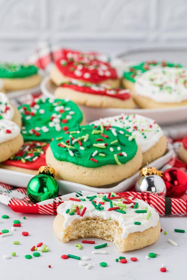 holiday cookies on a counter - one cookie with a bite out!