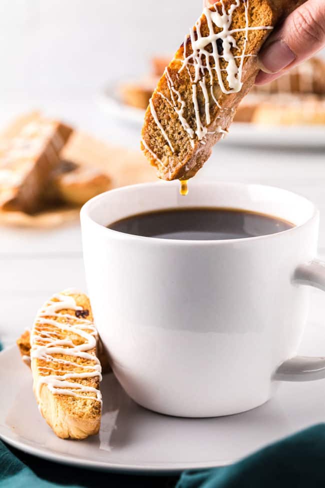 dunking biscotti in a hot cup of coffee