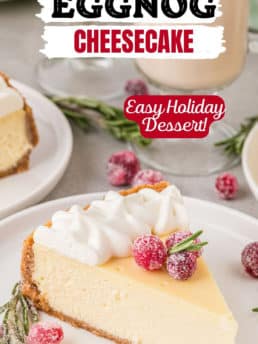 cheesecake with whip cream and sugared cranberries