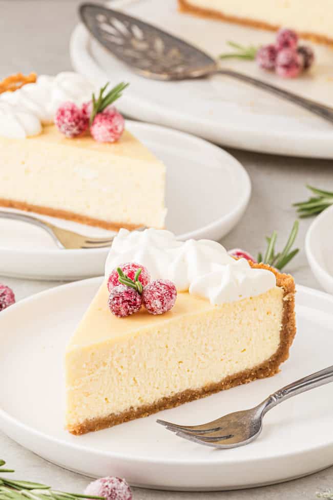 cheesecake on dessert plates with forks