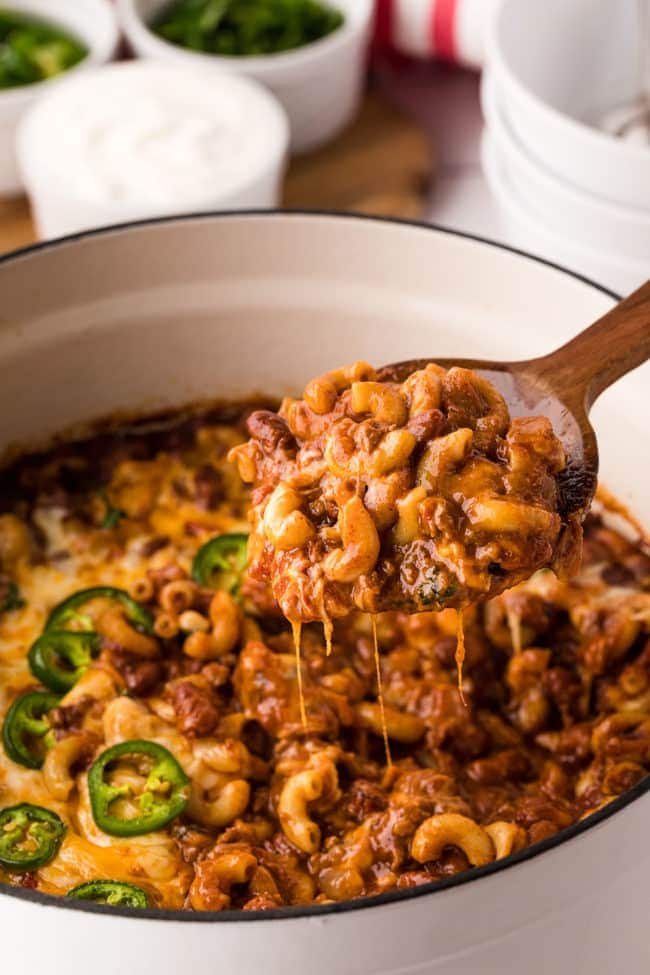 dutch oven filled with cheesy chili mac