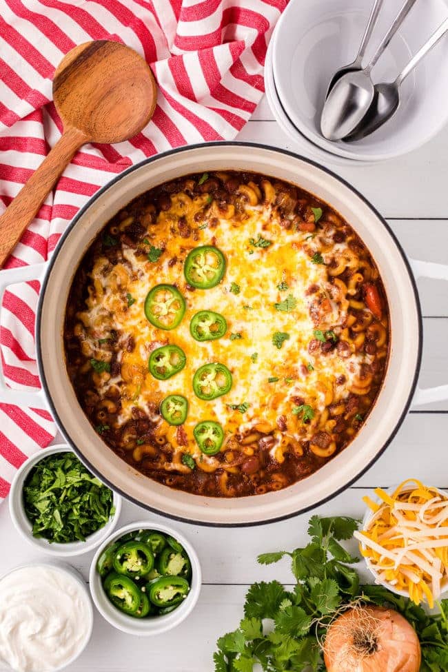pot of chili with melted cheese on top