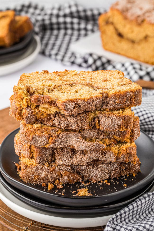 stacked sliced of cinnamon quick bread on a plate