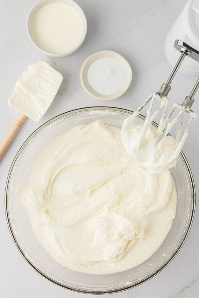 cream cheese frosting in mixing bowl with beaters