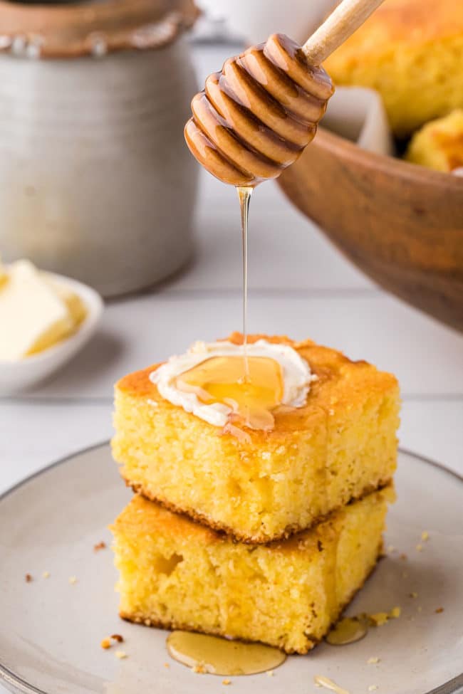 2 servings of cornbread stacked and drizzled with honey