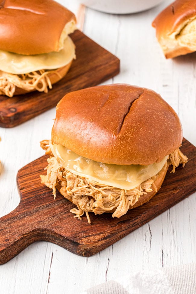 shredded chicken sandwich on a bun with melted cheese