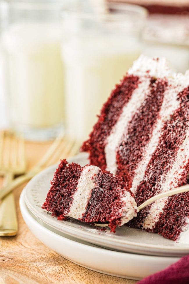 slice of red velvet cake with a bite on the fork