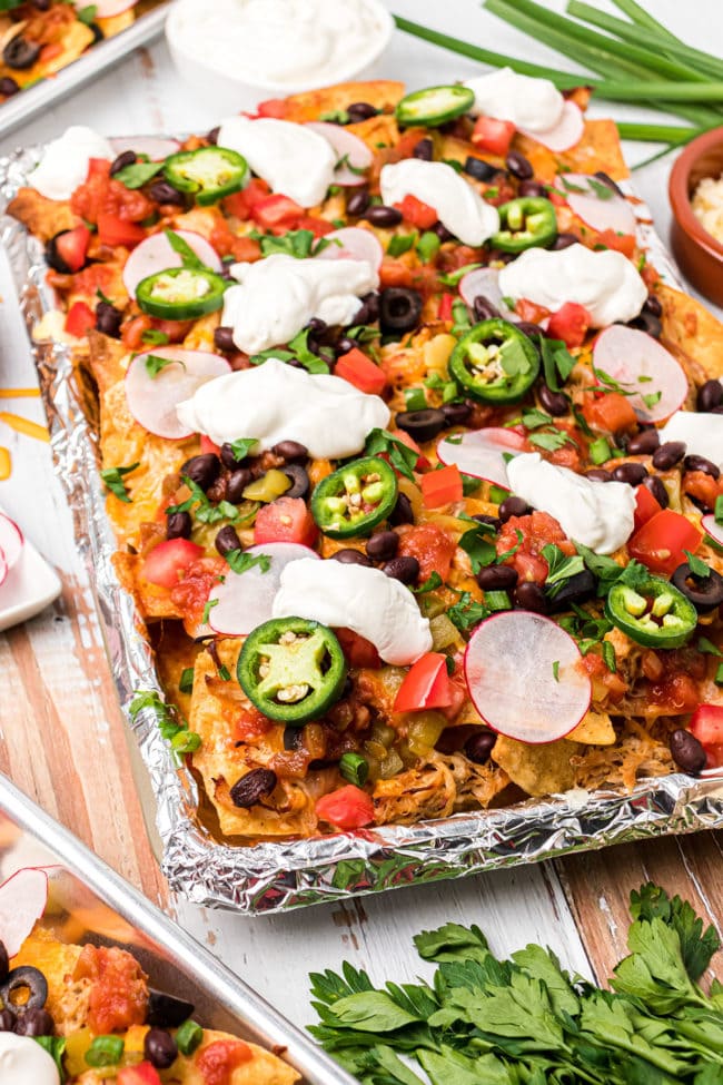 baked nachos on a pan with foil