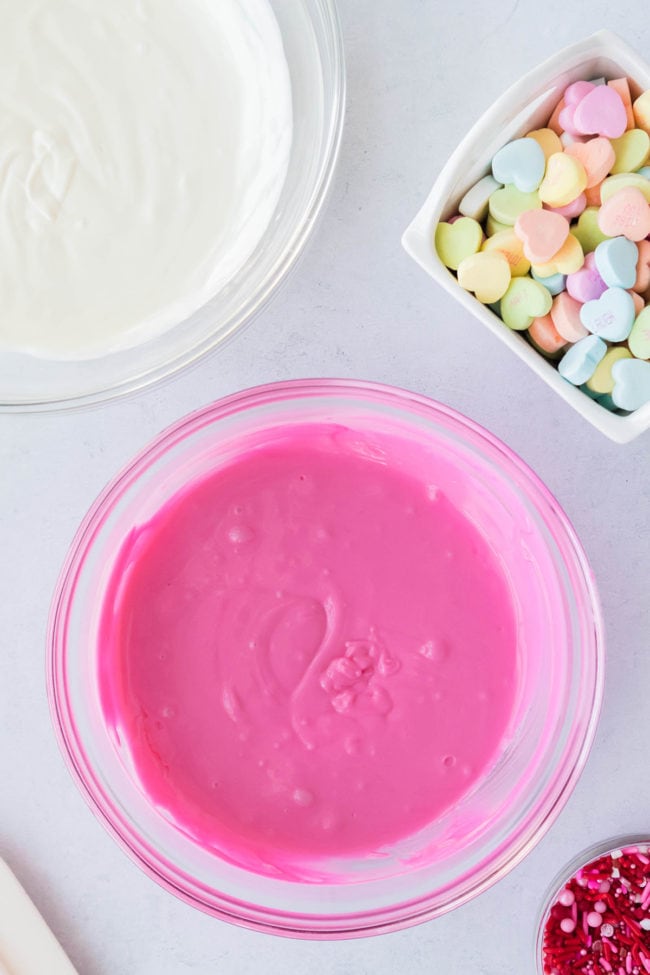 melted pink candy melts in a glass bowl