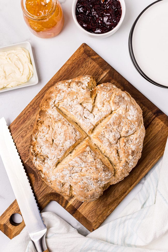 fresh baked loaf of Irish soda bread on cutting board