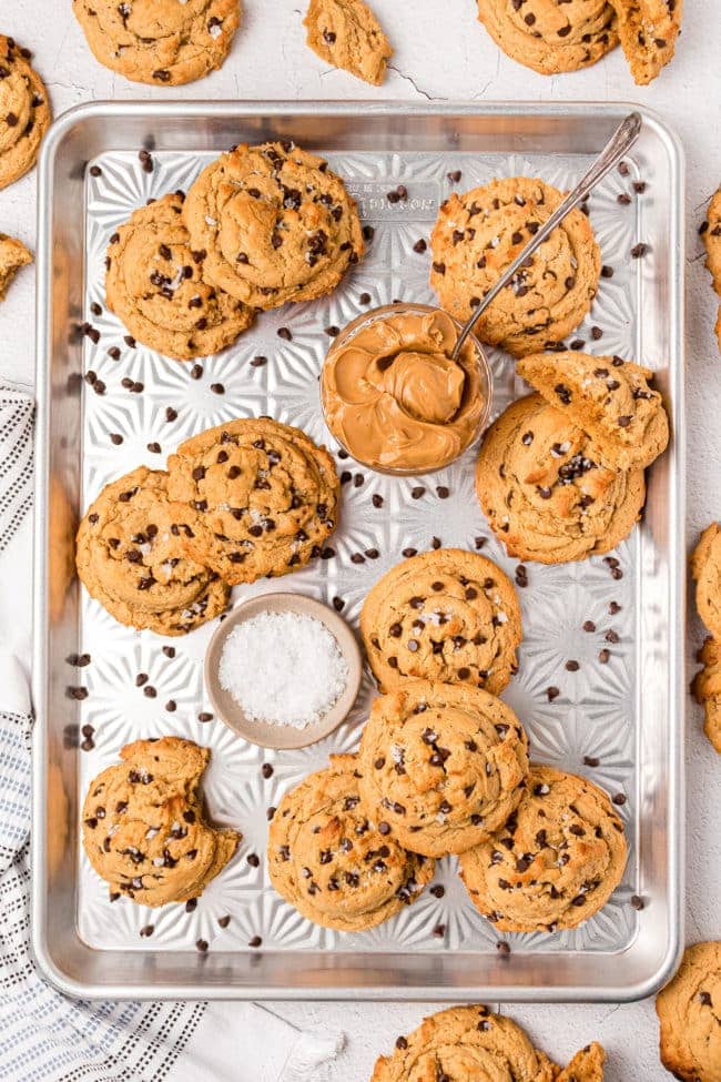 chocolate chip peanut butter cookies sprinkled with sea salt displayed on a pretty pan