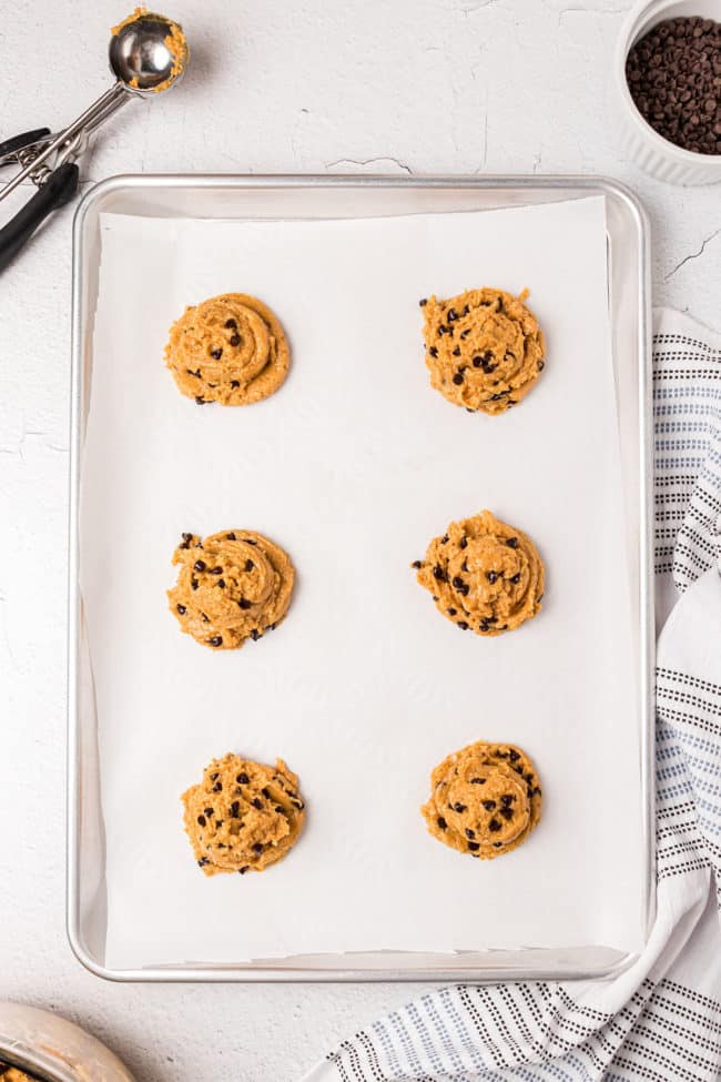 double scooped cookie dough on a baking sheet